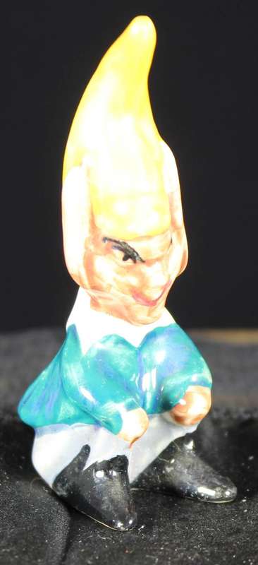 Porcelain pixie sitting