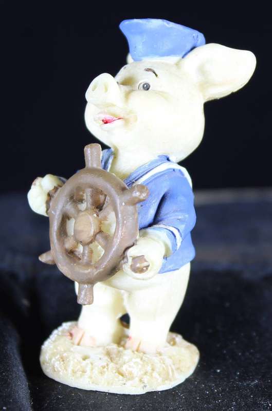 Miniature piggy with ship`s wheel