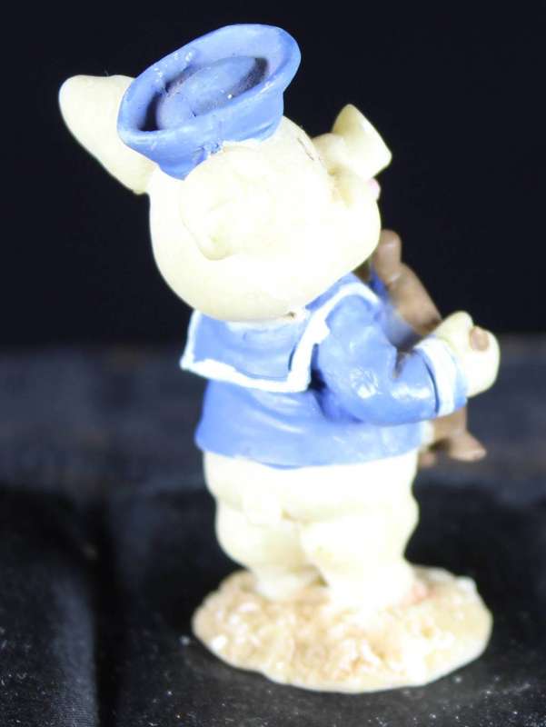 Miniature piggy with ship`s wheel