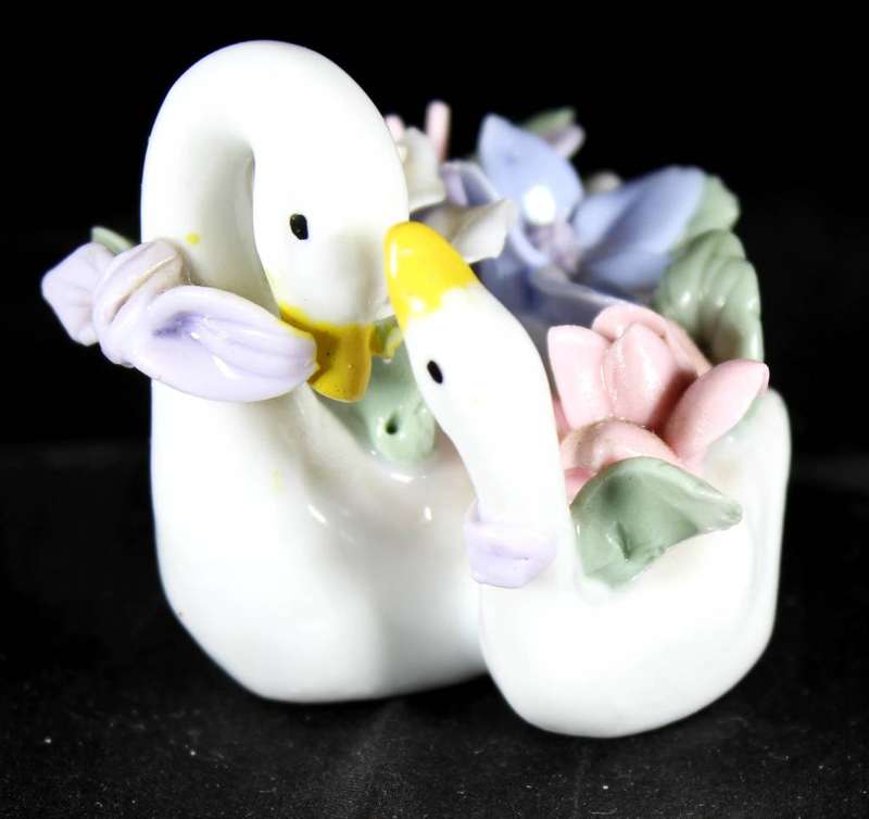 Two swans with flowers