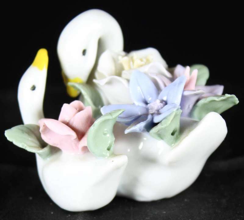 Two swans with flowers