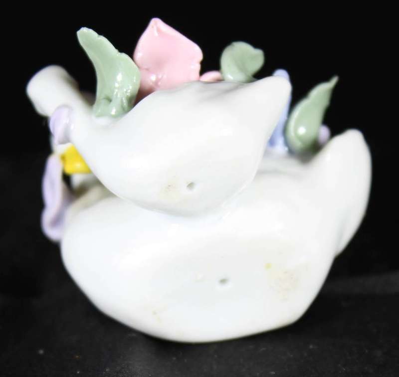 Two swans with flowers