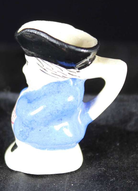 Miniature character jug - man with blue jacket