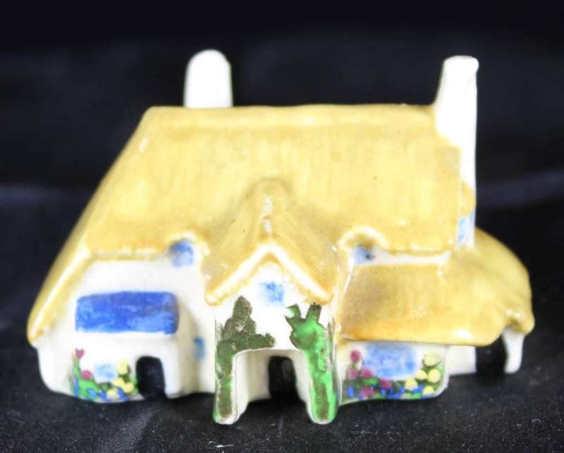 Miniature house with embossed paint