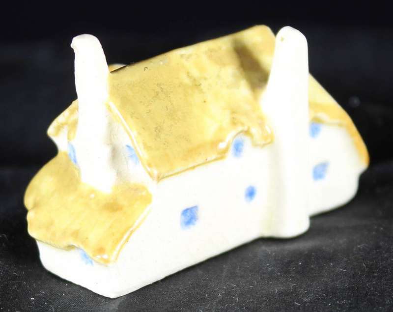 Miniature house with embossed paint