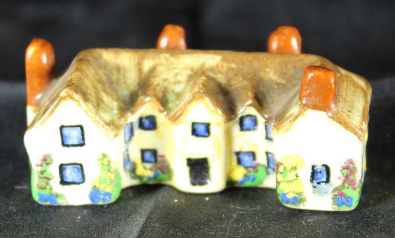 Miniature house with four chimneys