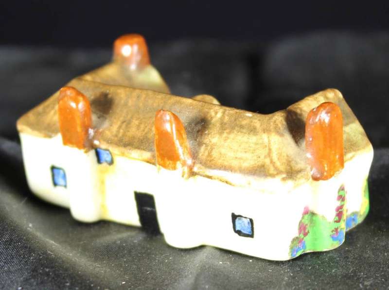 Miniature house with four chimneys
