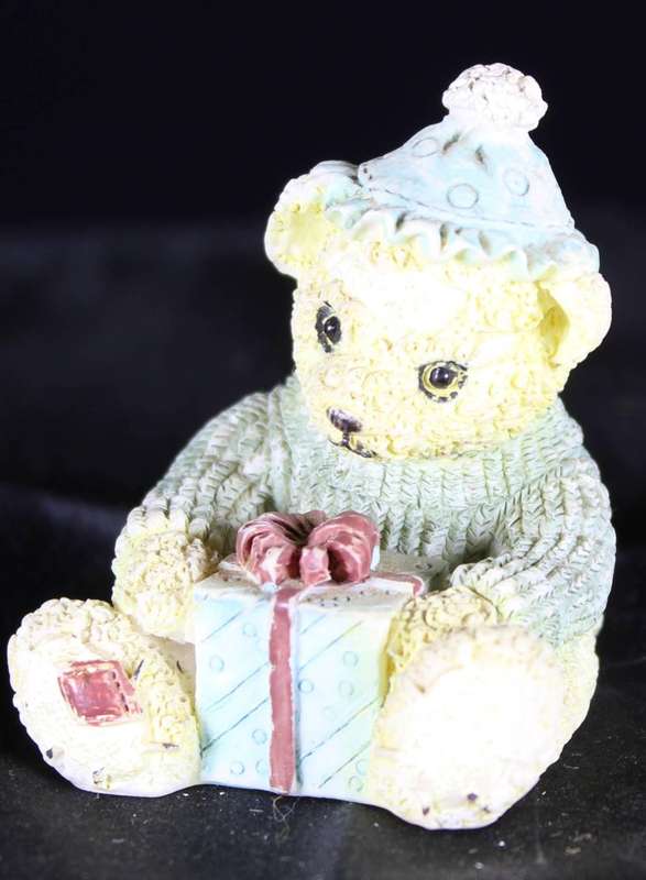 Little bear girl with hat and present