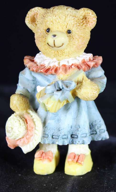Little bear girl in dress with hat & present