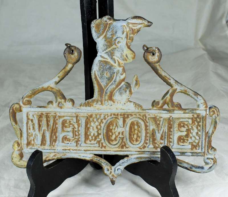 Vintage cast iron welcome sign with doggy