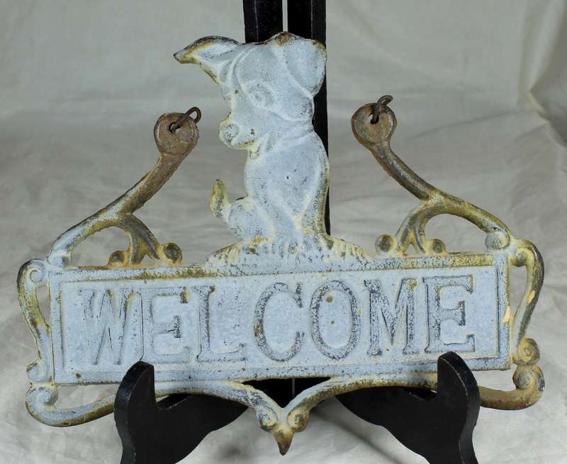 Vintage cast iron welcome sign with doggy