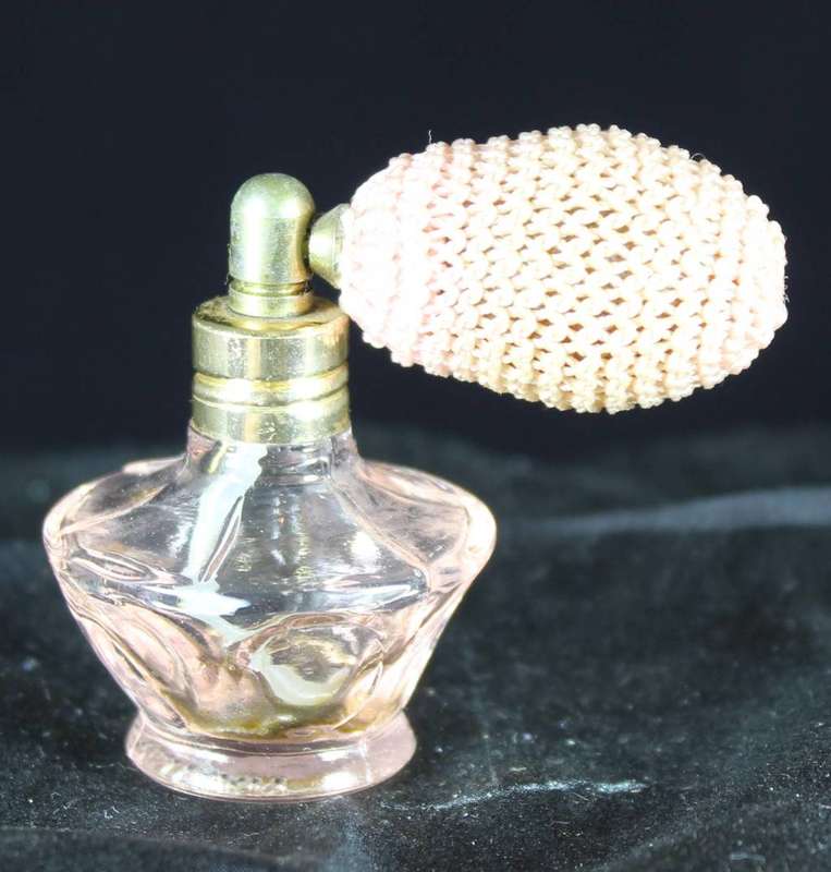 Vintage pink perfume bottle with atomizer