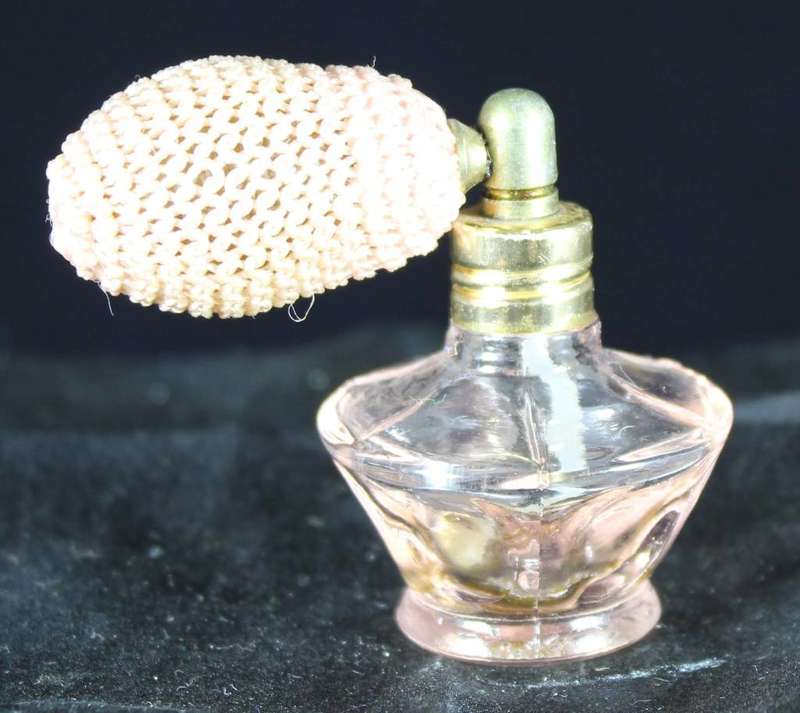 Vintage pink perfume bottle with atomizer
