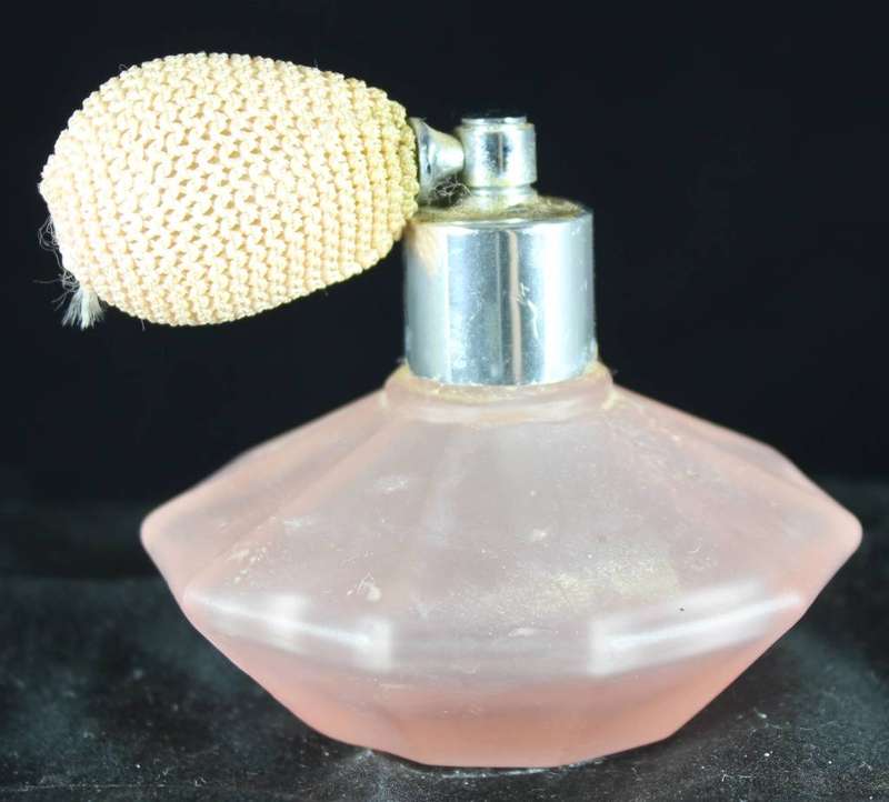 Vintage peach perfume bottle with atomizer