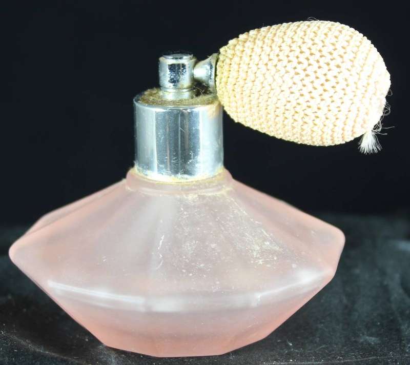 Vintage peach perfume bottle with atomizer