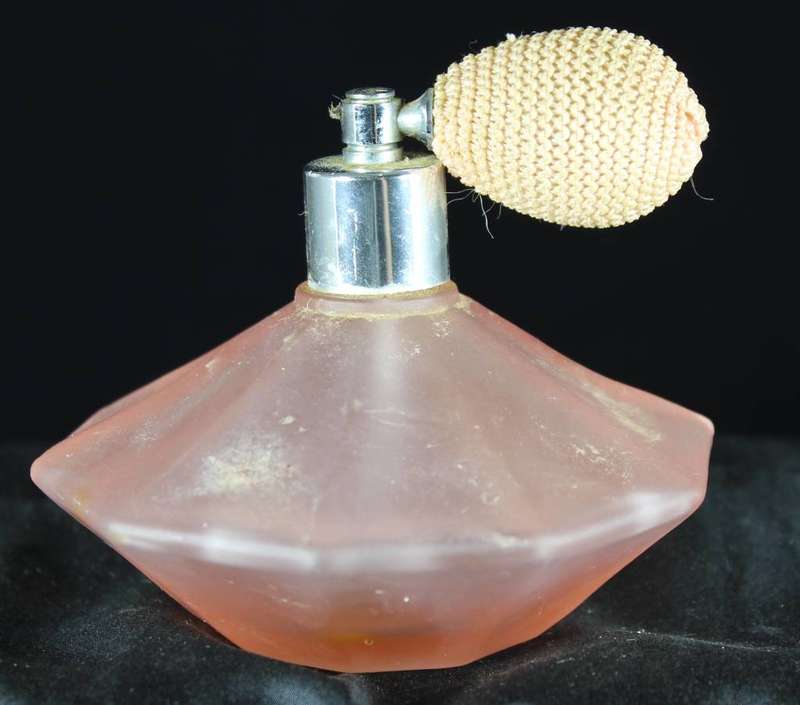 Vintage orange perfume bottle with atomizer