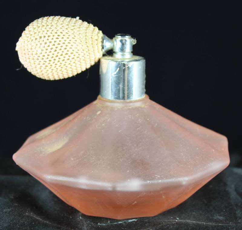 Vintage orange perfume bottle with atomizer