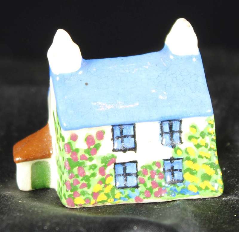 Miniature house with blue roof