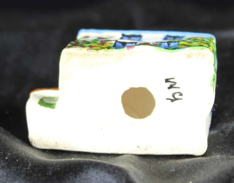 Miniature house with blue roof