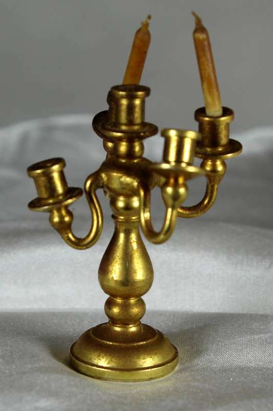 Miniature brass candelabra with two candles