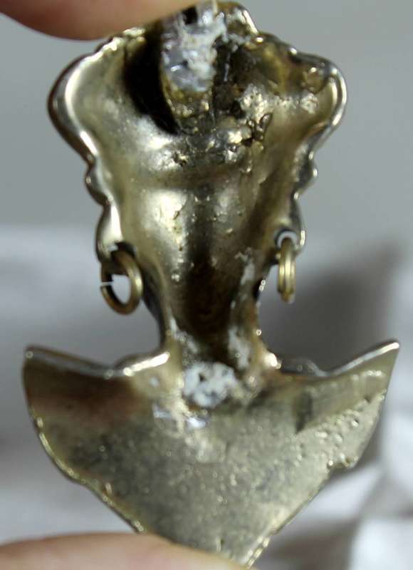 Metal traditional face pendant