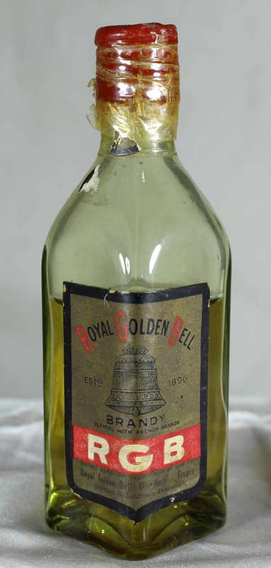 Mini liquor bottle - red golden bell (Southern Rhodesia)