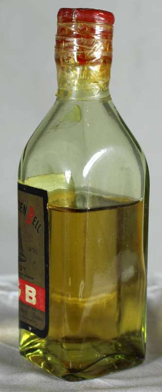 Mini liquor bottle - red golden bell (Southern Rhodesia)