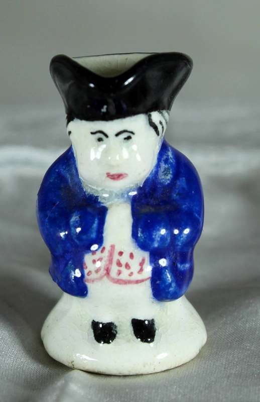 Miniature Toby jug with blue jacket