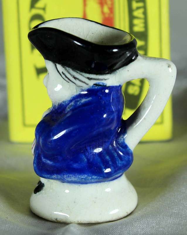 Miniature Toby jug with blue jacket