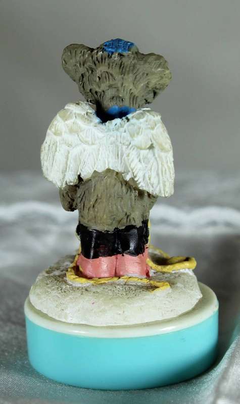 Miniature plastic angel bear boy