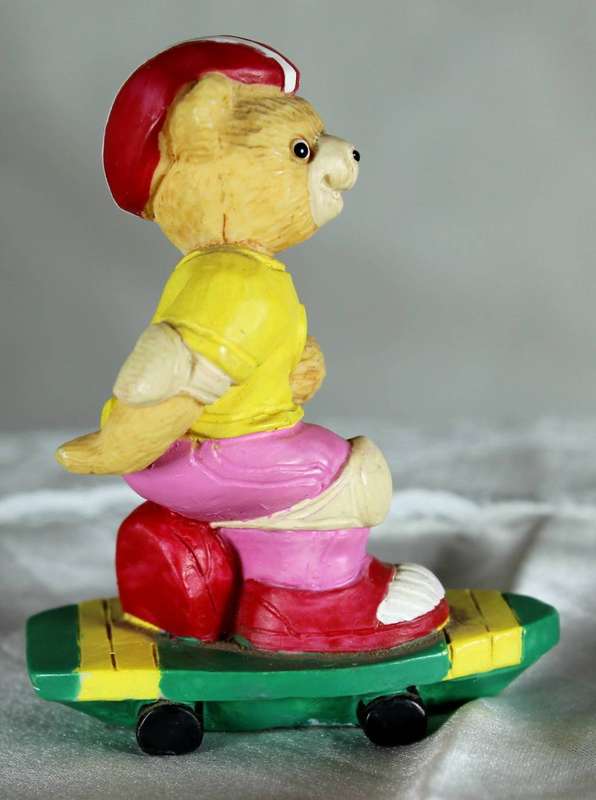 Bear riding a skateboard