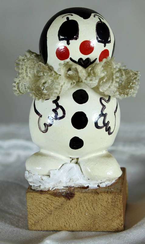 Vintage clown on a wood block
