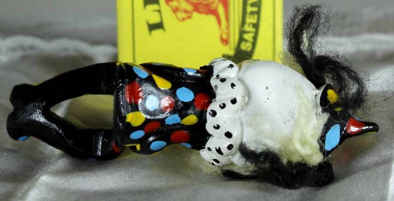 Sitting clown with legs hanging off