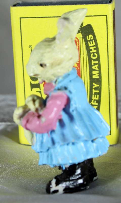 Miniature bunny In blue dress with doll