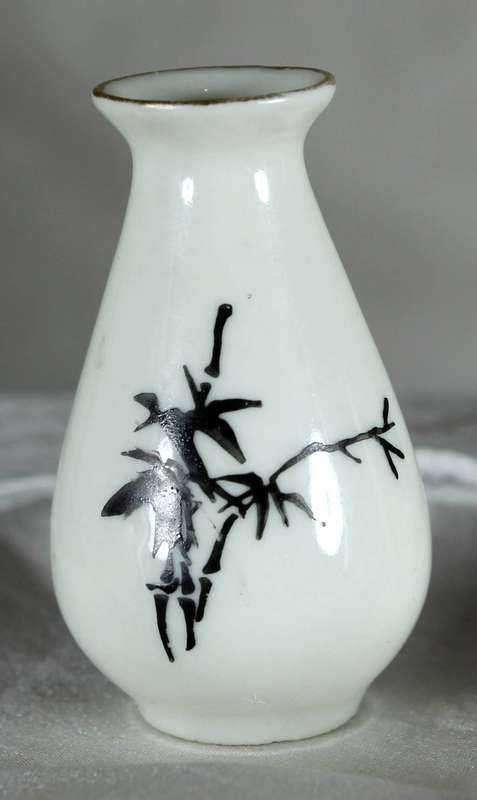 Miniature white bud vase with black motif & golden gilding