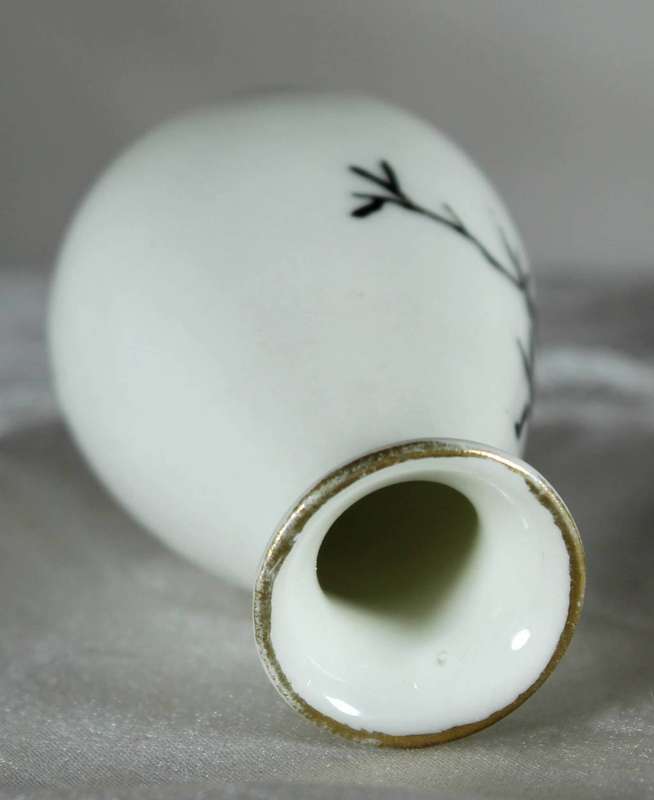 Miniature white bud vase with black motif & golden gilding