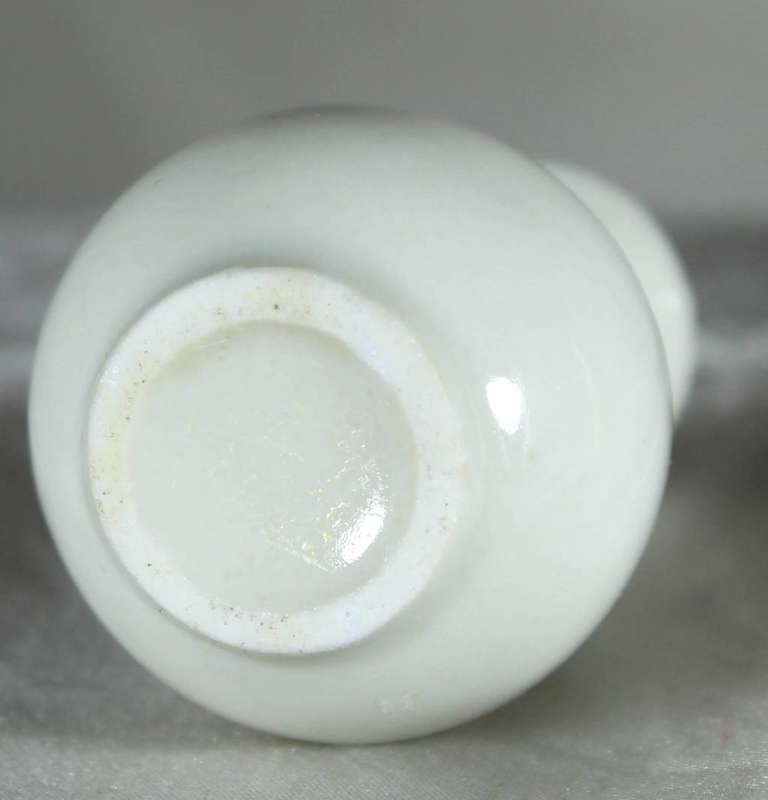 Miniature white bud vase with black motif & golden gilding