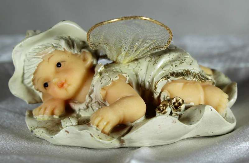 Vintage ceramic Tinkerbell figurine with flower wings