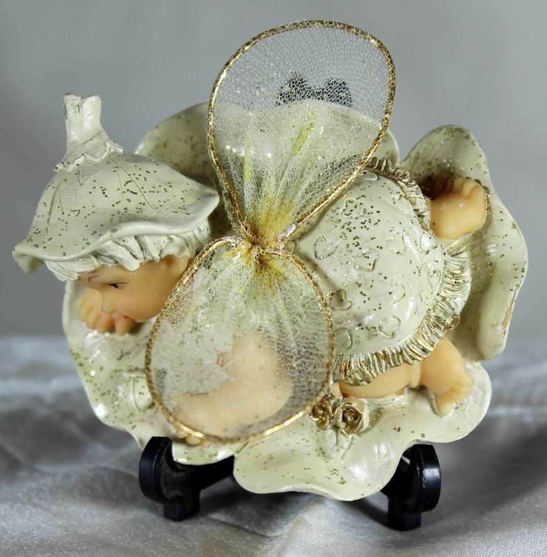 Vintage ceramic Tinkerbell figurine with flower wings