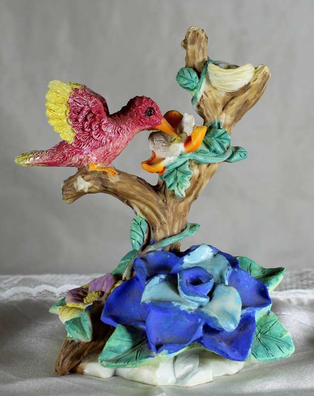 Vintage bird feeding from flower fear fer nest