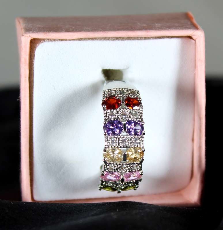 Costume jewellery - five coloured emerald look ring