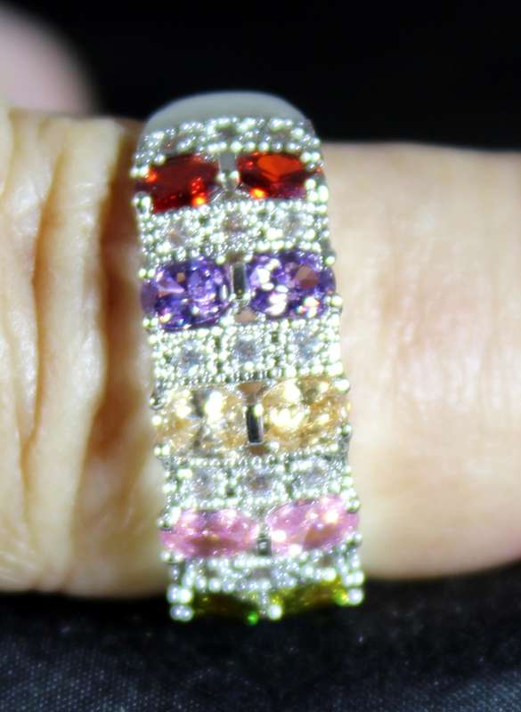 Costume jewellery - five coloured emerald look ring