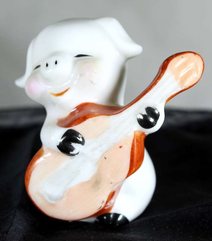 Vintage porcelain miniature musician pig - playing the guitar