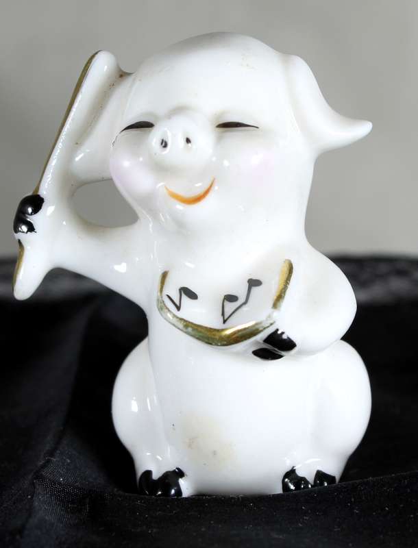 Vintage porcelain miniature musician pig - the conductor