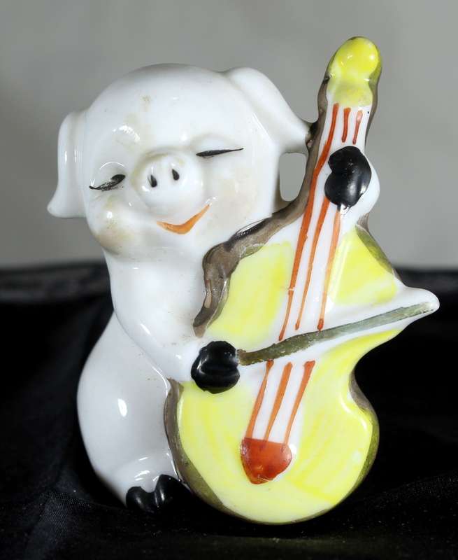Vintage porcelain miniature musician pig - playing the cello