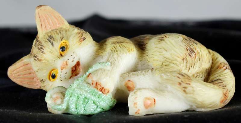 Small Cat Playing with Ball of Yarn