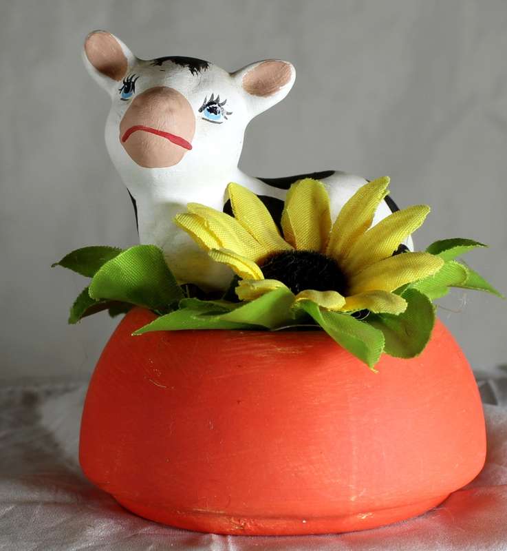 Ceramic Cow Lying Down on a Flower Bed - BID NOW!!!
