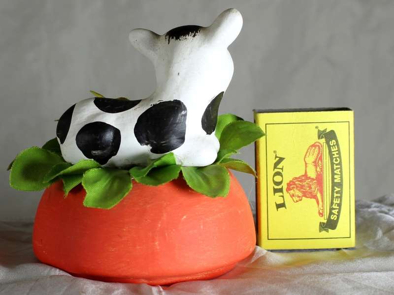 Ceramic Cow Lying Down on a Flower Bed - BID NOW!!!