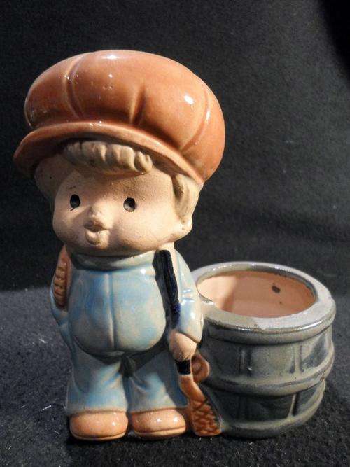 Boy and barrel figurine