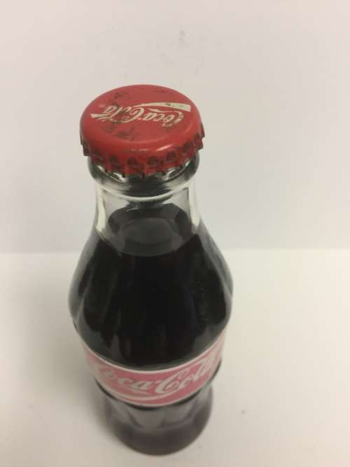 VINTAGE and RARE SEALD Commemorative Coca Cola bottle with foil label "thanking the seller"